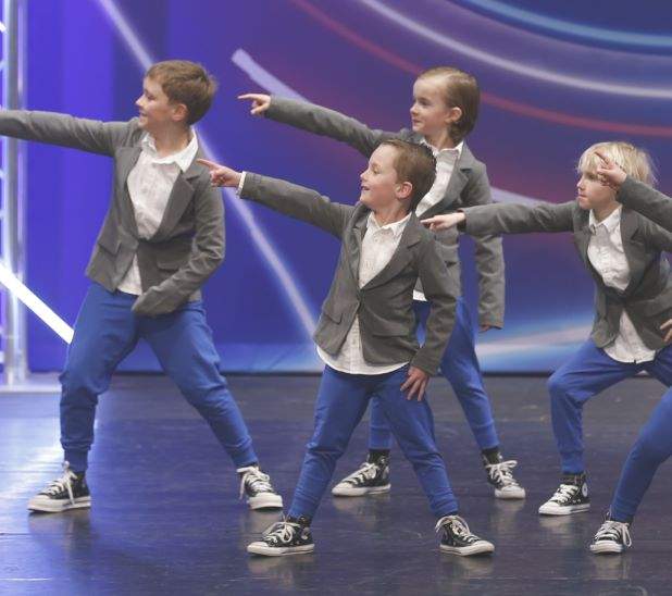 A group of boys dancing