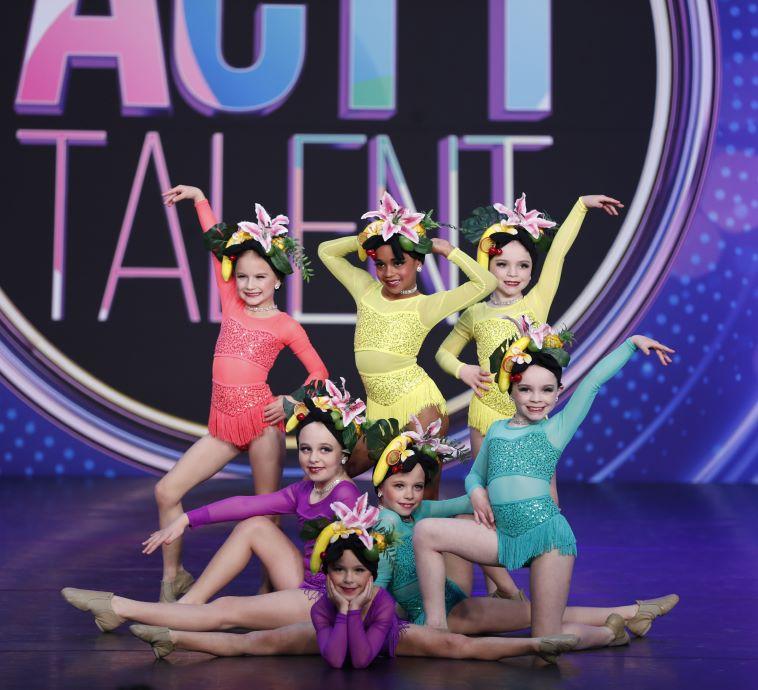A group of Act 1 Talent dancers on stage
