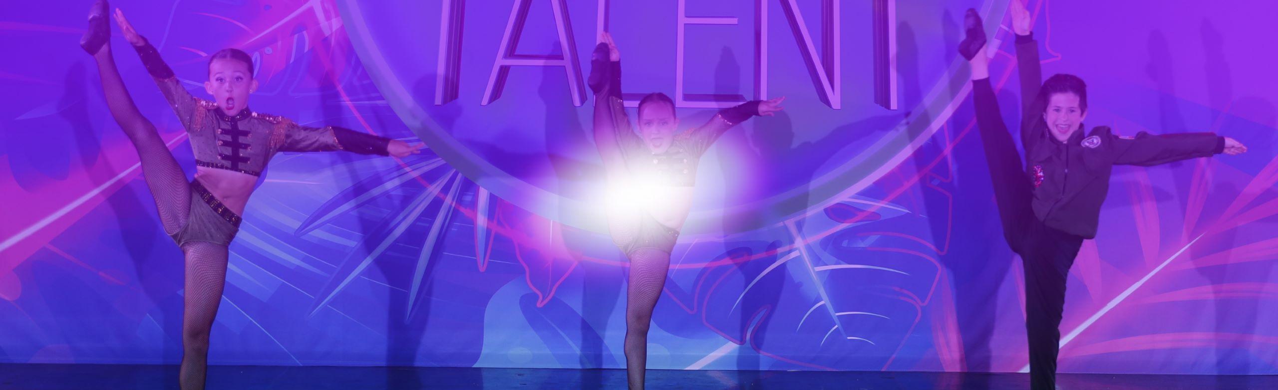 Three dancers on stage